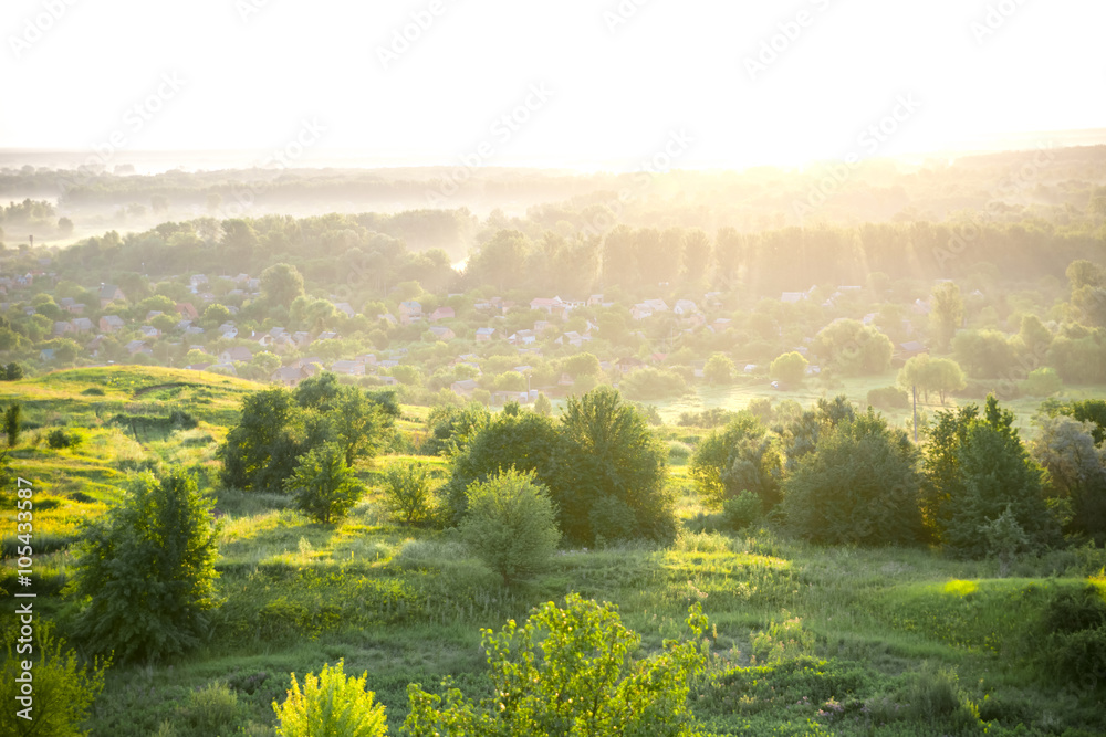 Beautiful rural landscape with sunrise over a meadow. Soft focus
