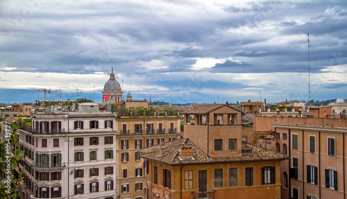 cityscape view from Piazza di Spagna during cloudy day in Rome, Italy 