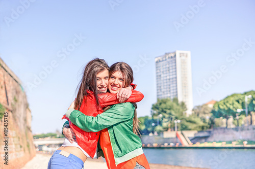 Best hipster friends hugging each others with skyscraper in back © DisobeyArt