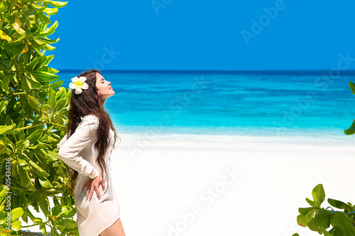 Free Beautiful Woman Enjoying Nature on tropical beach. Beauty G