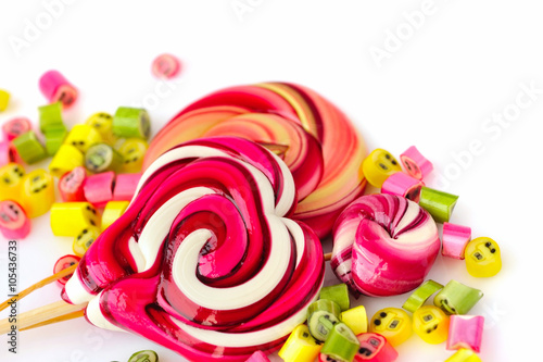 Colorful candies and lollipops on a white background