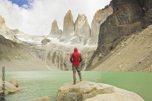 Tablou canvas man standing near lake in patagonia, torres del paine