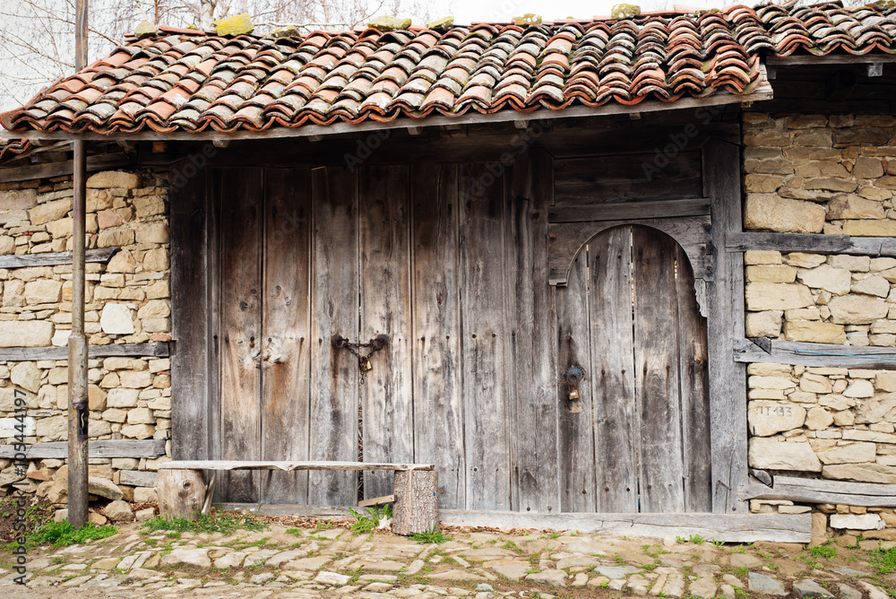 Detail of vintage wooden door, stone wall