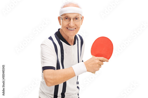 Cheerful senior man playing ping-pong