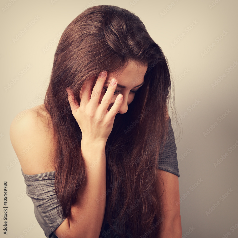 Happy laughing young woman cover the hand her face and giggling. Happy laughing young woman cover the hand her face and giggling.