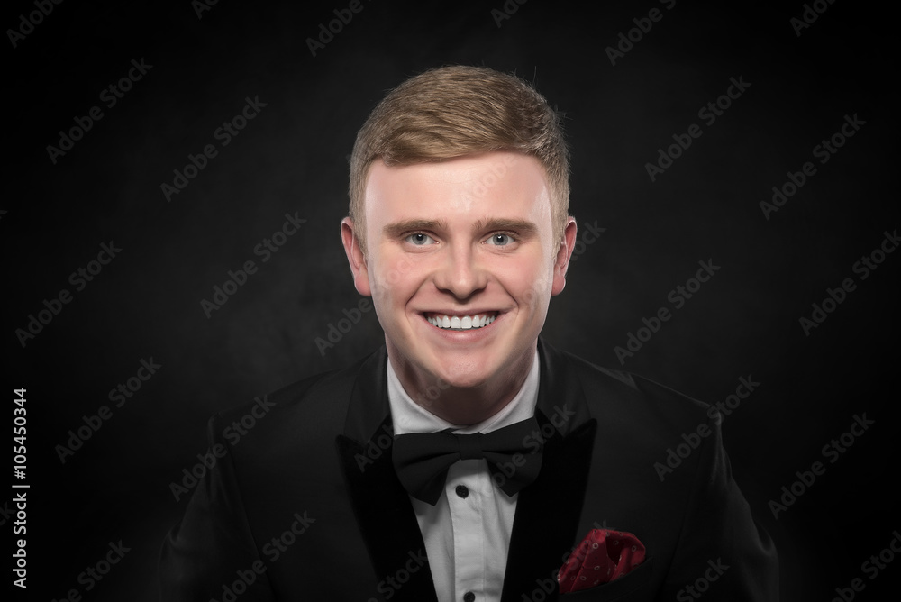 Fototapeta premium Young handsome man in black suit.
