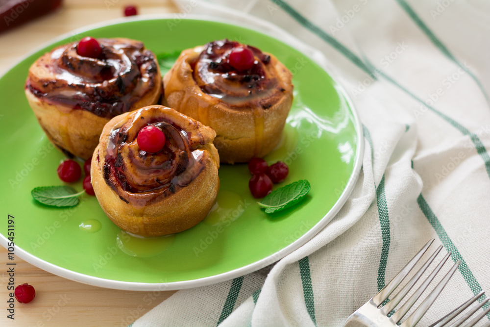 Homemade rolls with cranberry, cinnamon and citrus glaze Homemade rolls with cranberry, cinnamon and citrus glaze