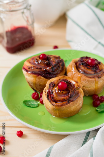 Homemade rolls with cranberry, cinnamon and citrus glaze