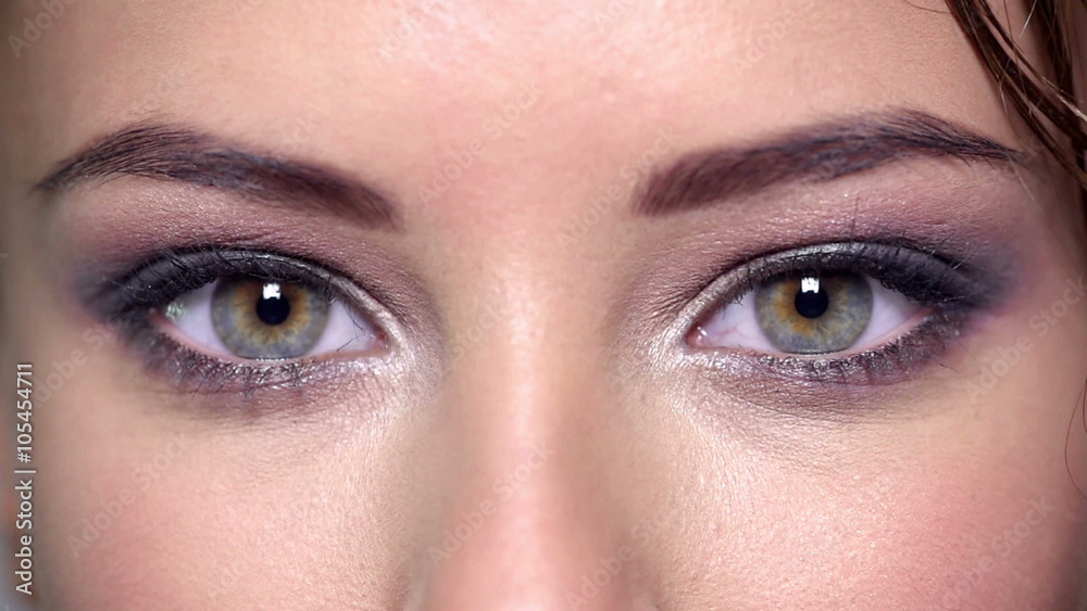 Closeup of women's eyes with color eye makeup.
