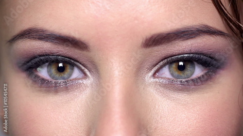 Closeup of women's eyes with color eye makeup.