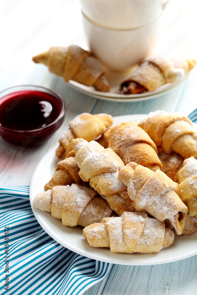 Fresh homemade croissants on a blue wooden table Fresh homemade croissants on a blue wooden table