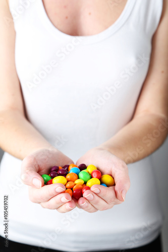 Woman's hands with candies