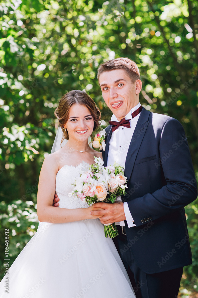 Married Couple in forest embracing Married Couple in forest embracing
