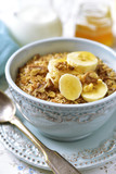 Granola with milk and banana slices.