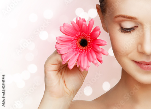 beauty natural young girl with flower pink gerbera