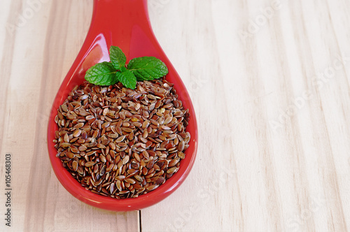  Brown flaxseeds. Healthy food supplement with vitamins and minerals. photo