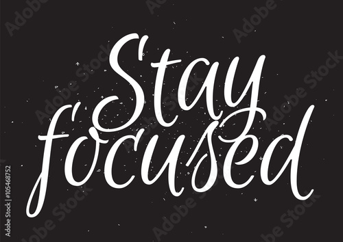 Stay focused inscription. Greeting card with calligraphy. Hand drawn design. Black and white.