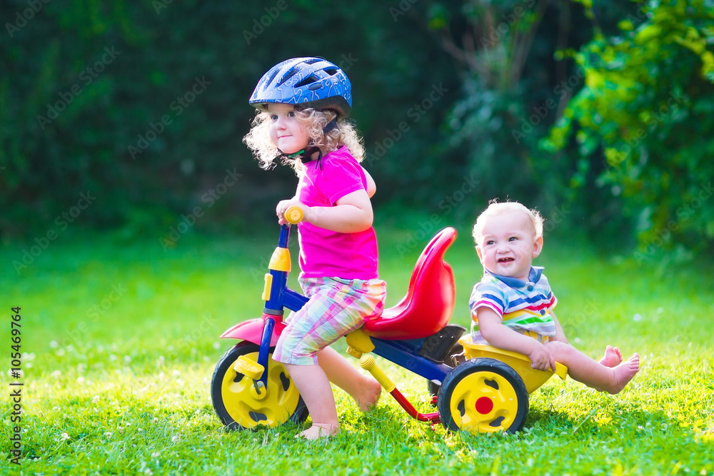 Two kids on a bike