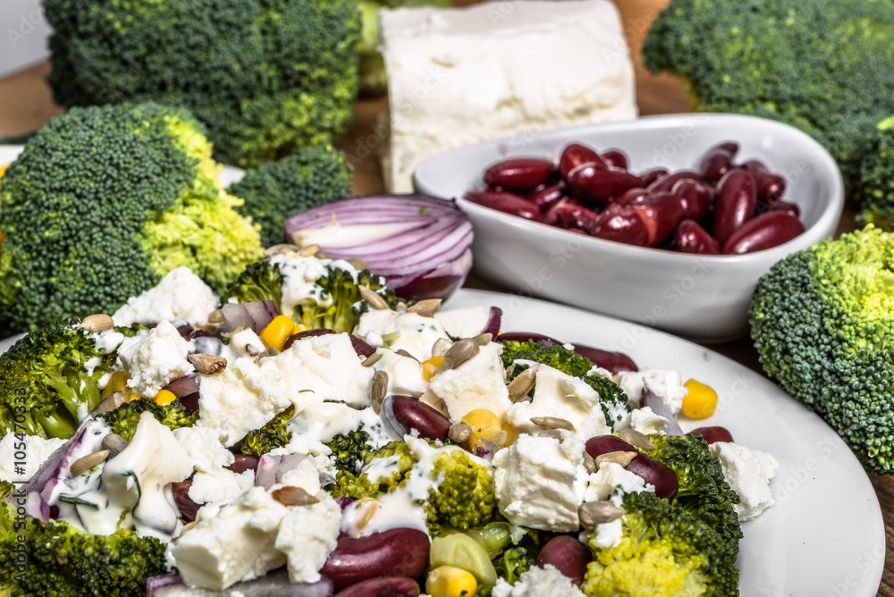 Broccoli salad with vegetables and feta cheese.