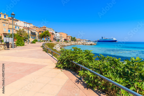 Promenade along sea in Ile Rousse coastal town, Corsica island, France
