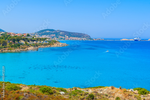 Azure sea bay and view of Ile Rousse coastal town, Corsica island, France