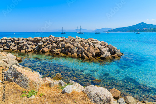 Turquoise sea water on coast of Corsica island in Ile Rousse town, France