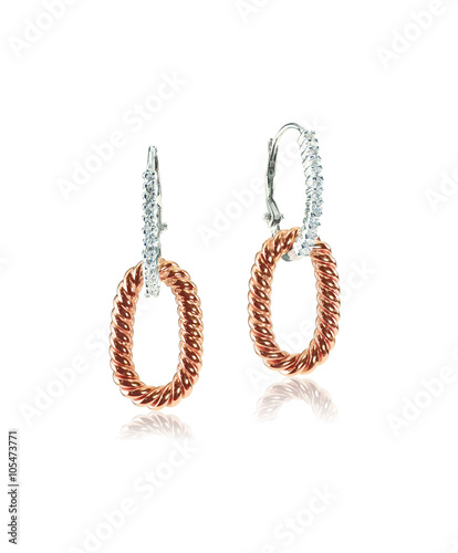 Rose gold and white gold diamond earrings isolated on white