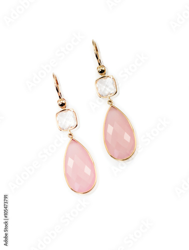 Pair of pink rose quarts dangle elegant earrings isolated on white with a description