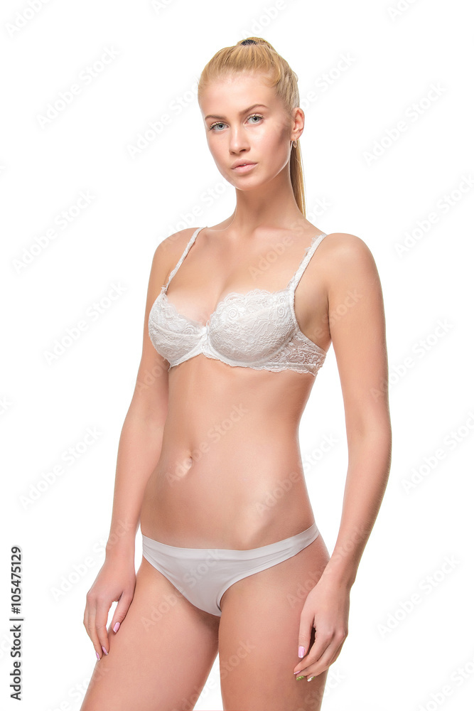 Young blonde woman in white underwear, studio Young blonde woman in white underwear, studio