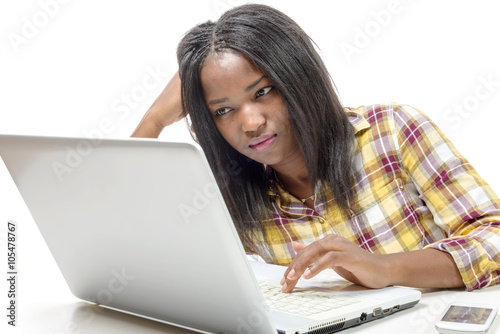 young African american working on laptop on the white