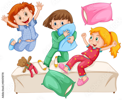 Three girls playing pillow fight at the slumber party
