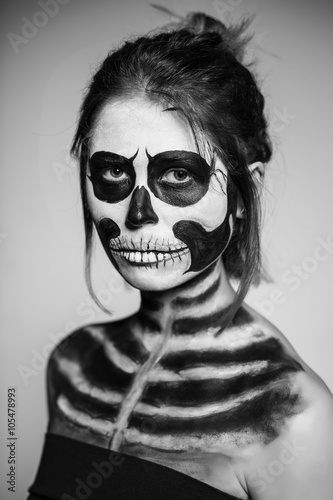 Woman painted like a zombie