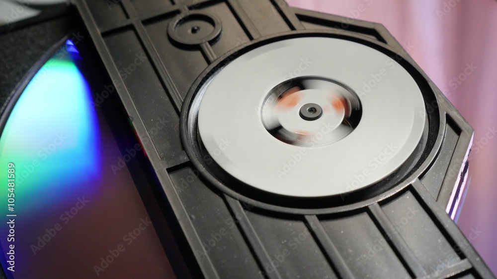 Entering compact disc mechanism and reading sequence start 4K 2160p UltraHD footage - DVD player mechanism close up 4K 3840X2160 UHD video Entering compact disc mechanism and reading sequence start 4K 2160p UltraHD footage - DVD player mechanism close up 4K 3840X2160 UHD video