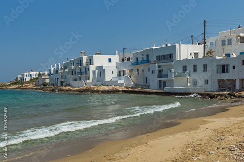 Small beach and white houses in town of Naoussa, Paros island, Cyclades, Greece