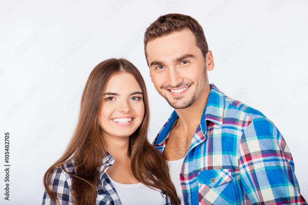 Portrait of happy cute smiling man and woman in love Portrait of happy cute smiling man and woman in love