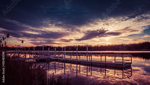 A dramatic sunset of deep purple and blue is seen at the dock of Owens Crossing, part of the Wallkill National Wildlife Refuge