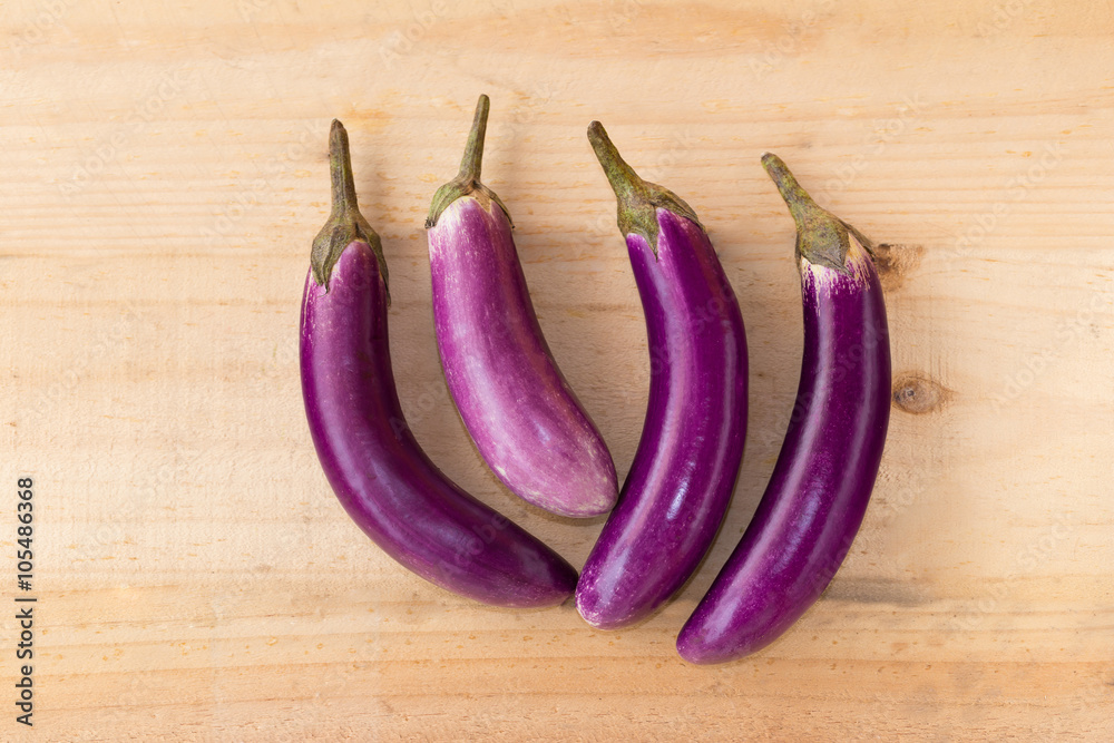 top view of eggplant on wood background top view of eggplant on wood background
