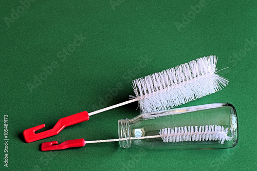 Brushes.
 Brushes for cleaning bottle on a green background.
