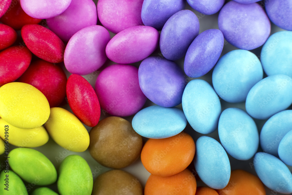 Macro detail of pile of coloured chocolate sweets Macro detail of pile of coloured chocolate sweets