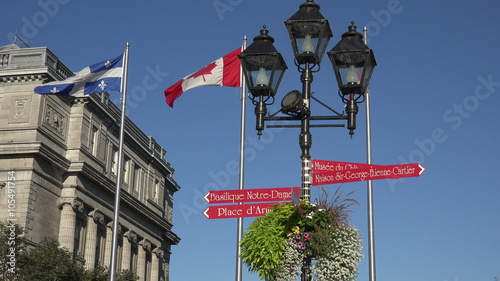 Signs and flags in front of Bonsecours market building, Montreal, Canada photo
