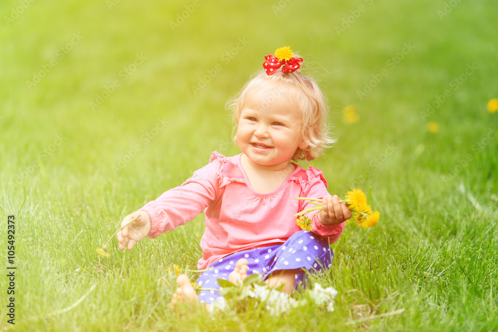 cute happy little girl with flowers in spring cute happy little girl with flowers in spring
