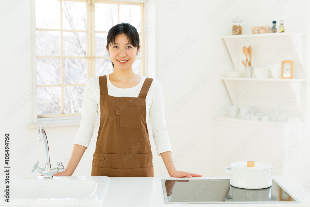 young asian woman in the kitchen young asian woman in the kitchen