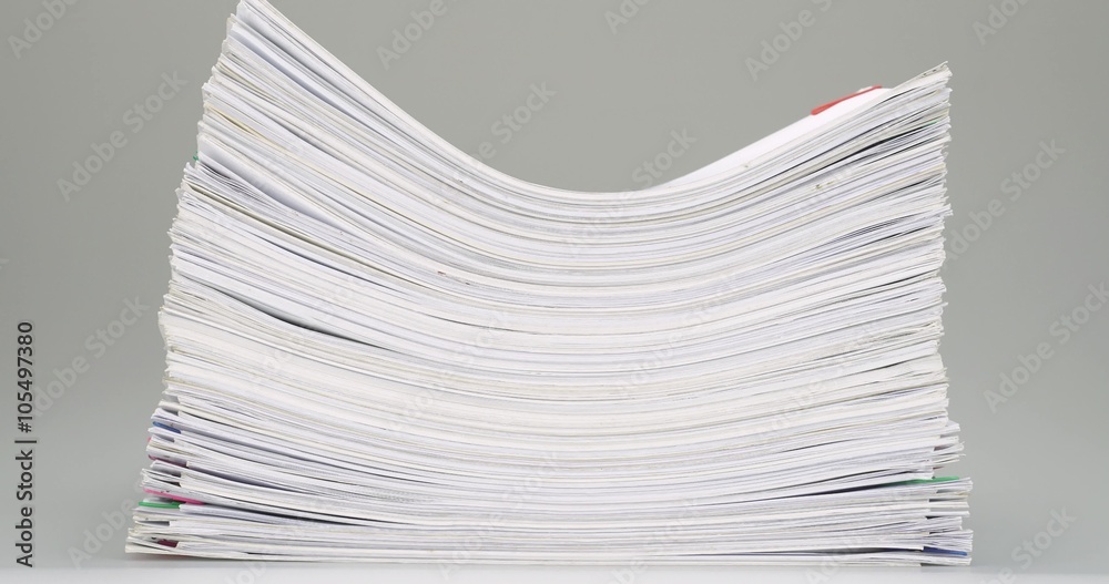 Pile paperwork place on white table time lapse