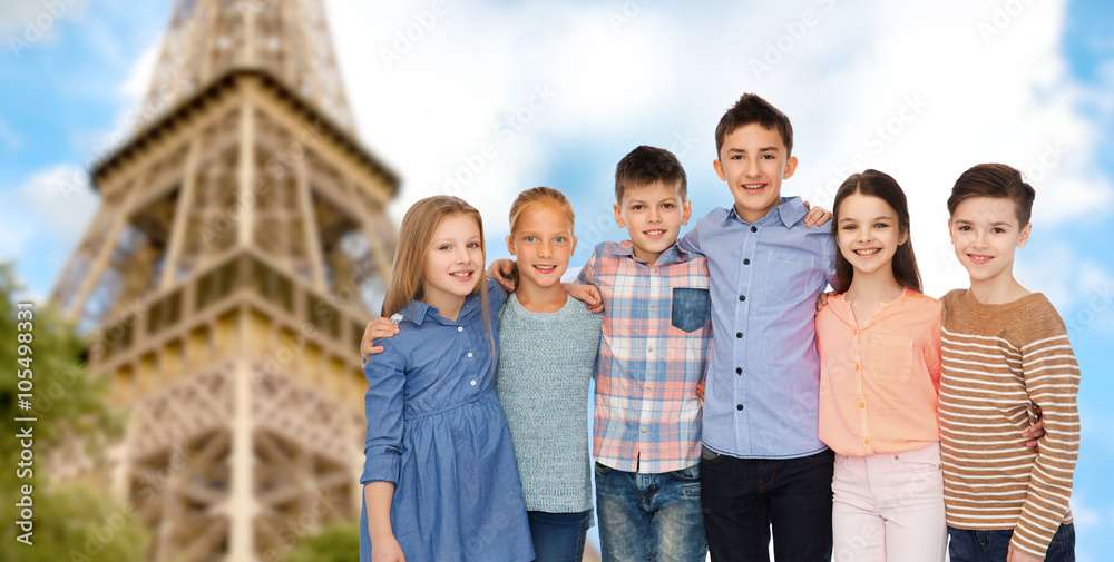 happy smiling children hugging over eiffel tower happy smiling children hugging over eiffel tower