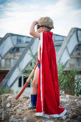 Obraz na plátne Little Boy superhero fantasy, playing outside