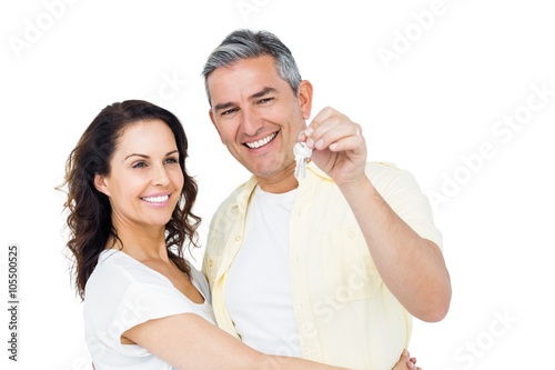 Portrait of happy couple holding home keys