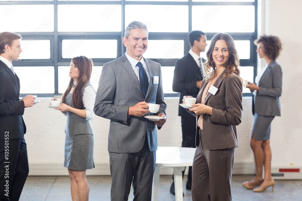 Businesspeople having a discussion during breaktime Businesspeople having a discussion during breaktime