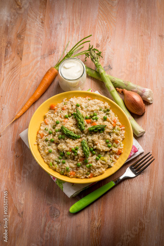 Rice with asparagus green peas and carrots