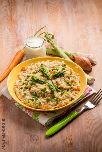 Rice with asparagus green peas and carrots