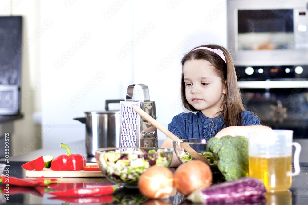 little daughter cooking in the kitchen little daughter cooking in the kitchen